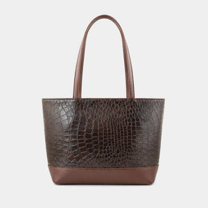 A dark brown tote bag with a crocodile-embossed texture on the main body and smooth brown handles and base, shown against a light gray background.