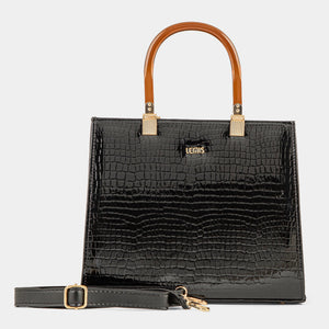 Black crocodile-patterned handbag with brown handle on a light gray background