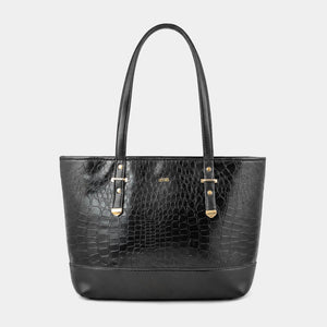 A black crocodile-embossed leather tote bag with dual top handles and gold-tone hardware, centered on a light gray background.