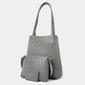 A gray faux-leather tote bag with a matching zippered pouch and shoulder strap, displayed on a clean light gray background.