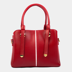 Red handbag with gold accents on a light gray background