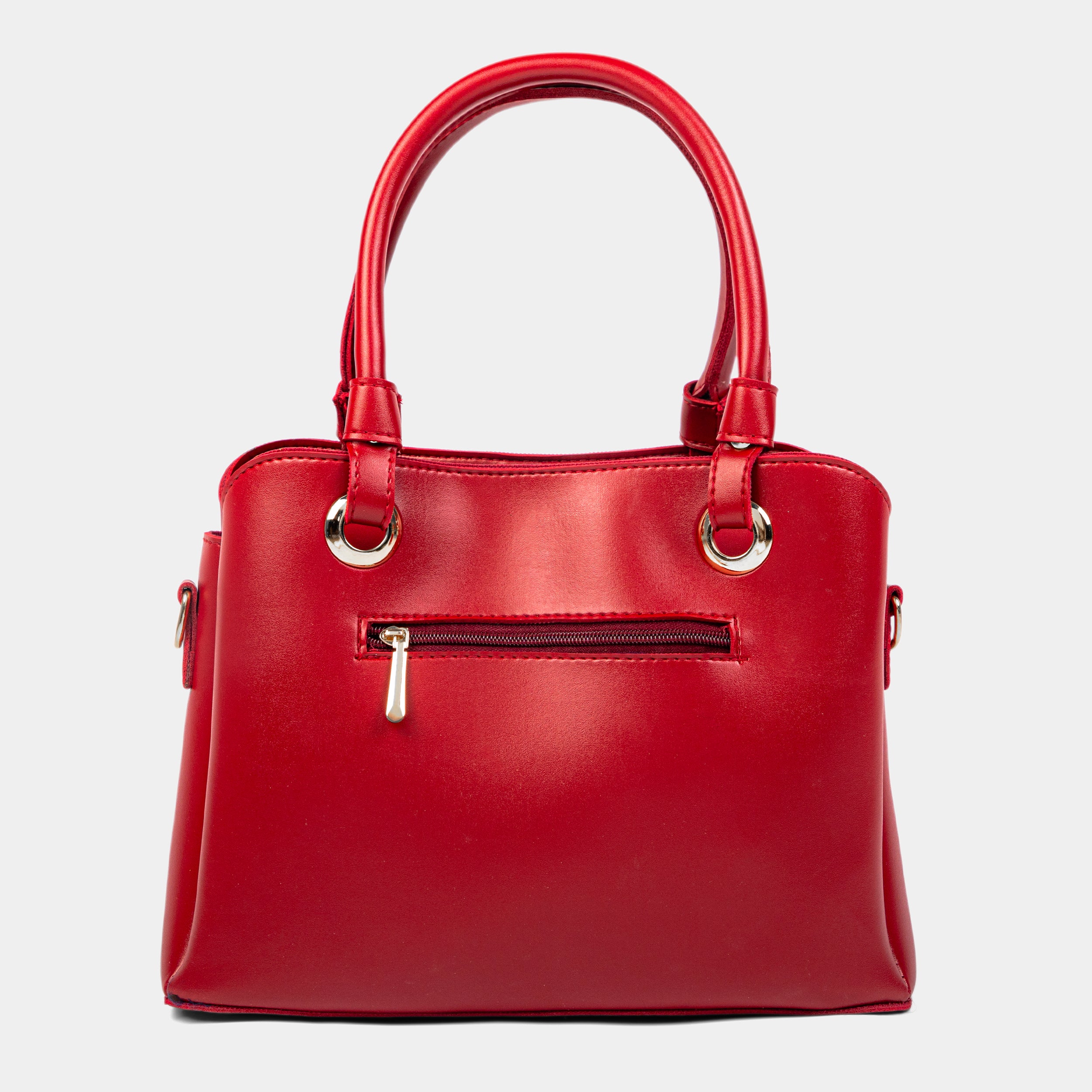 Red handbag with gold accents on a light gray background