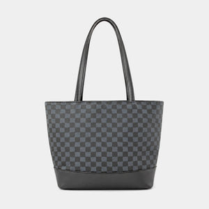 A dark gray and black checkerboard patterned tote bag with black leather handles and a black base, shown against a light gray background.