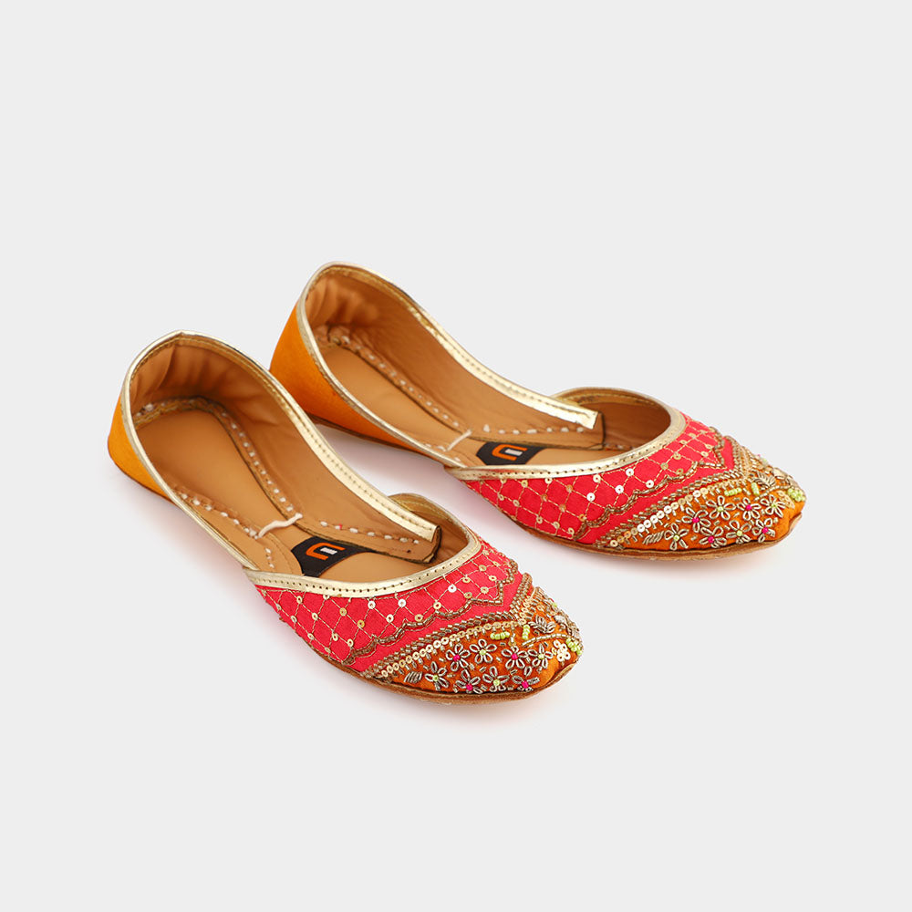 Shop exclusive ladies's khussa shoes with vibrant silk, sequins, and handcrafted elegance for weddings and events.
