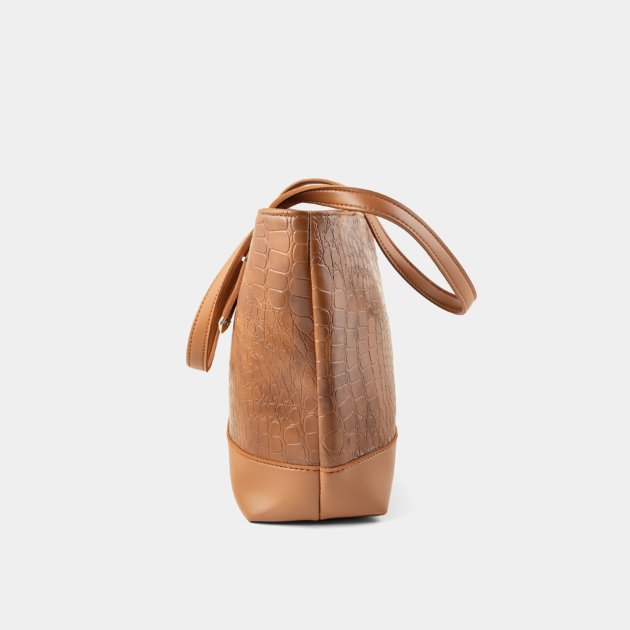 A tan leather handbag with a crocodile-embossed texture and matching leather handles, shown from the back on a light gray background.