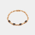 Gold-Tone Bamboo Bracelet with Black Crystals