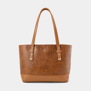 A structured tan leather tote bag with a crocodile-embossed texture on the main body, smooth leather trim and handles, and gold-tone hardware, shown against a light gray background.