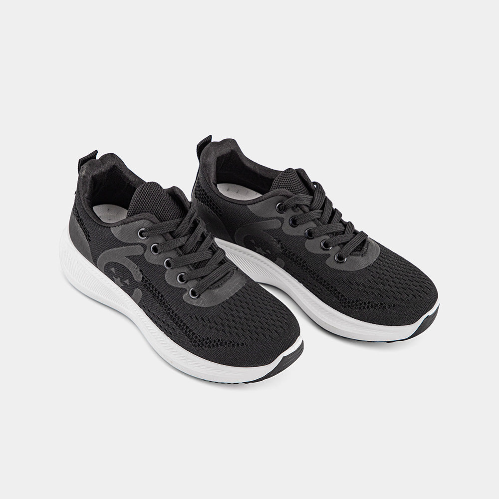 Black Lemis sneakers with a white sole, featuring a breathable upper and cushioned support, perfect for casual wear and light workouts