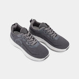 Grey Lemis sneakers featuring a breathable knitted upper with a cushioned white sole, designed for comfort and casual wear, suitable for various occasions