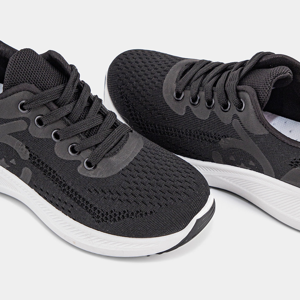 Black Lemis sneakers with a white sole, featuring a breathable upper and cushioned support, perfect for casual wear and light workouts