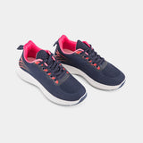 A stylish navy blue sneaker with pink accents and a white sole. The sneaker has a mesh upper and a comfortable design, perfect for everyday wear or athletic activities.