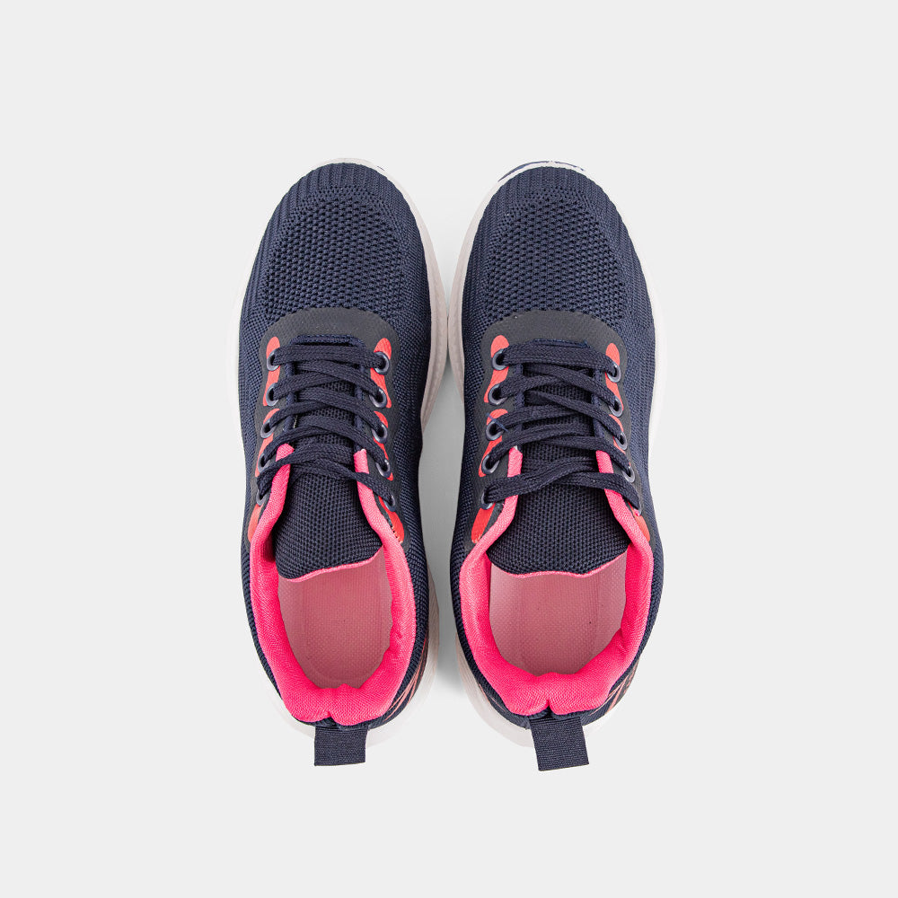 A stylish navy blue sneaker with pink accents and a white sole. The sneaker has a mesh upper and a comfortable design, perfect for everyday wear or athletic activities.