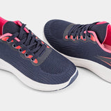 A stylish navy blue sneaker with pink accents and a white sole. The sneaker has a mesh upper and a comfortable design, perfect for everyday wear or athletic activities.